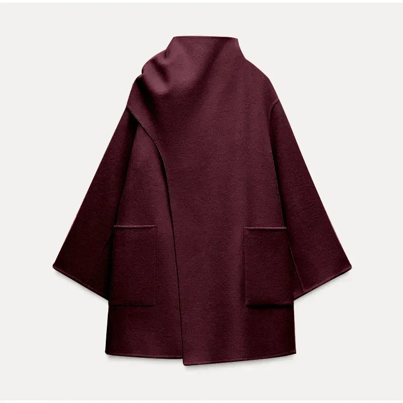 "Eva | Kappa mit Schal" pourrait être réécrit comme "Eva | Manteau à capuche avec écharpe".